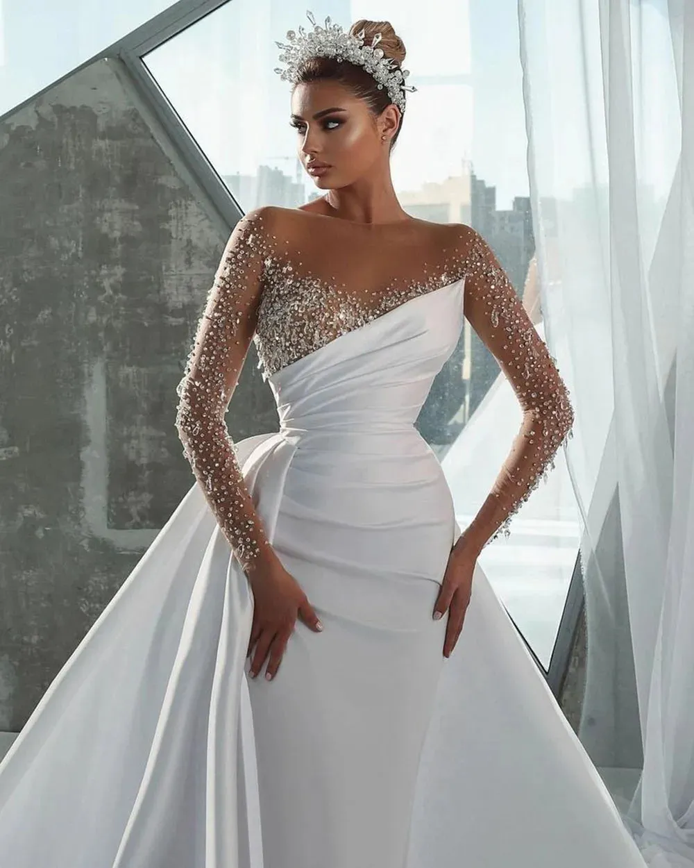 Elegant Mermaid Wedding Dress with Illusion Neckline, Beaded Long Sleeves, and a Detachable Overskirt